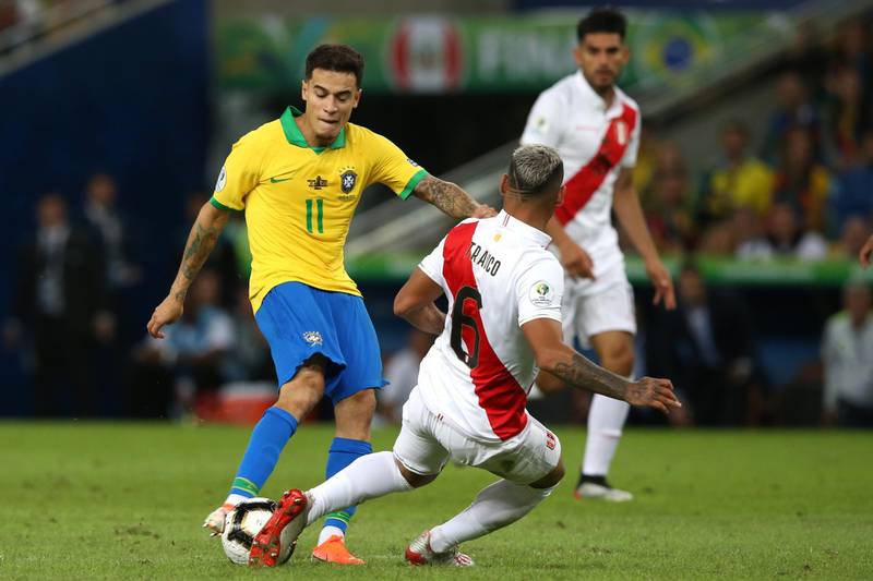 Philippe Coutinho is challenged by Peru's Miguel Trauco. Getty