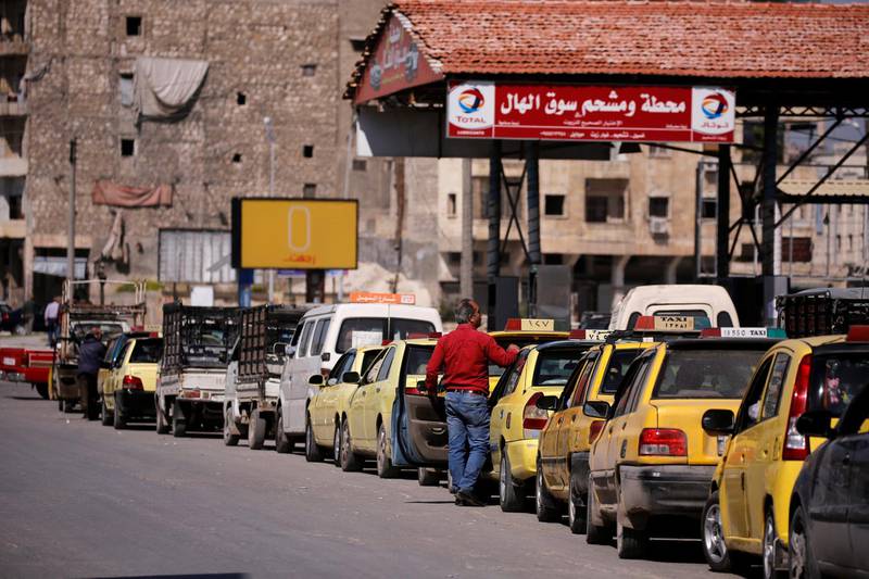 Motorists line up at a gasoline station as they wait to fuel up in Aleppo, Syria April 11, 2019. Picture taken April 11, 2019. REUTERS/Omar Sanadiki