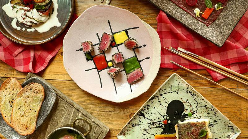 Paul Klee is a dish of tuna tataki with squid ink, tomato coulis and yellow bell pepper and rocket sauce, the vibrant colours of which mimic Klee’s artworks