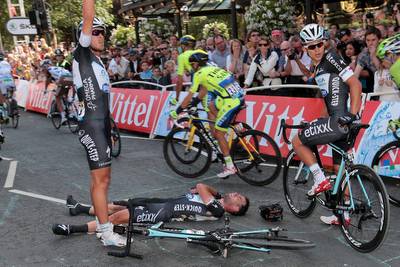 Mark Cavendish, ground, awaits treatment following his crash during the final sprint of the first stage of the 101st Tour de France on Saturday. Fred Mons / EPA / July 5, 2014