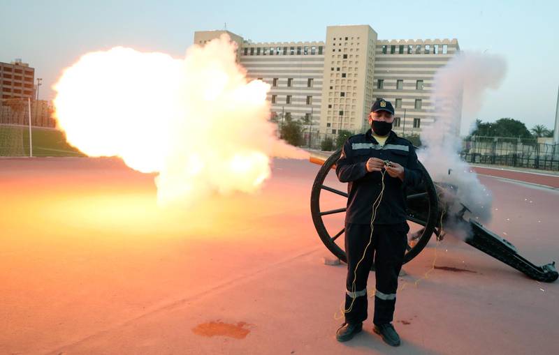 Egyptian policeman Mohamed Nasser fires a Ramadan cannon, traditionally used to announce the time to break fast, in Cairo, Egypt. EPA