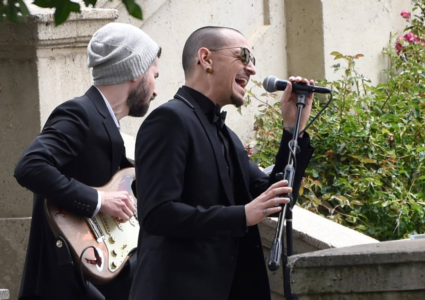 FILE - In this May 26, 2017 file photo, Chester Bennington, of Linkin Park, performs "Hallelujah" at a funeral for Chris Cornell at the Hollywood Forever Cemetery in Los Angeles. The Los Angeles County coroner says Bennington, who sold millions of albums with a unique mix of rock, hip-hop and rap, has died in his home near Los Angeles. He was 41. Coroner spokesman Brian Elias says they are investigating Benningtonâ€™s death as an apparent suicide but no additional details are available. (Photo by Chris Pizzello/Invision/AP, File)