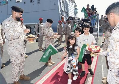 Saudi citizens are met by Saudi Royal Navy staff as they arrive at Jeddah after being evacuated from Sudan. Reuters 
