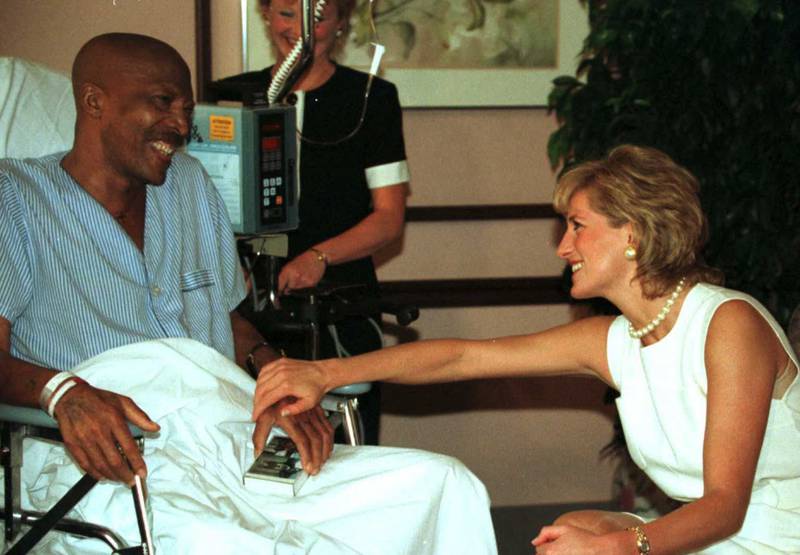 Princess Diana meets with John Collins, a 51-year-old lung cancer patient, while visiting Chicago's Northwestern Memorial Hospital's Hospice in 1996. AFP