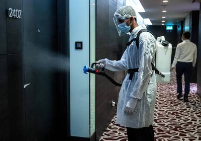 Abu Dhabi, United Arab Emirates, July 12, 2020.   Sofitel Abu Dhabi Corniche Hotel with updated Covid-19 precautionary measures.  A cleaner sanitises a walkway leading to the hotel rooms.Victor Besa  / The NationalSection:  StandaloneReporter: