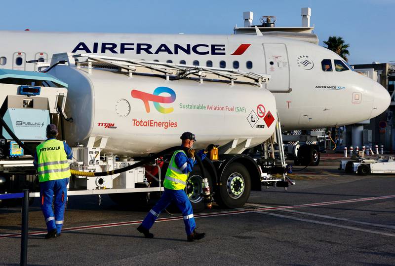 An Air France aircraft, operated with sustainable aviation fuel produced by TotalEnergies, is refuelled before its first flight from Nice to Paris in October. Reuters