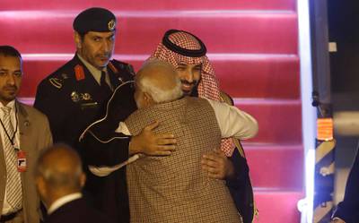 Saudi Arabia's Crown Prince Mohammed bin Salman hugs India’s Prime Minister Narendra Modi upon his arrival at an airport in New Delhi. Reuters