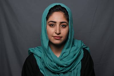 Radio journalist and artist Rozina Sherzad, 19, poses for a portrait in Kandahar.