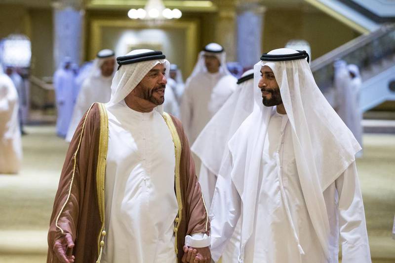 Sheikh Suroor bin Mohammed Al Nahyan, left, arrives with Sheikh Hamad bin Tahnoon Al Nahyan at the wedding reception on Monday. Donald Weber / Crown Prince Court - Abu Dhabi
