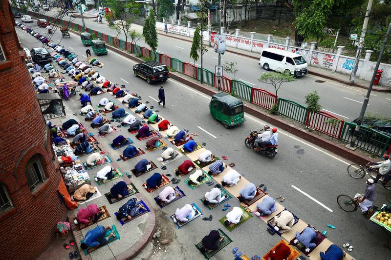 Muslims attend Friday prayers on the street in Dhaka, Bangladesh.  Reuters