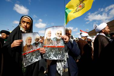 Iranian people carry pictures of the late Iran's Quds Force top commander Qassem Suleimani and Iraqi militia commander Abu Mahdi al-Muhandis during the forty days memorial in Najaf. Reuters