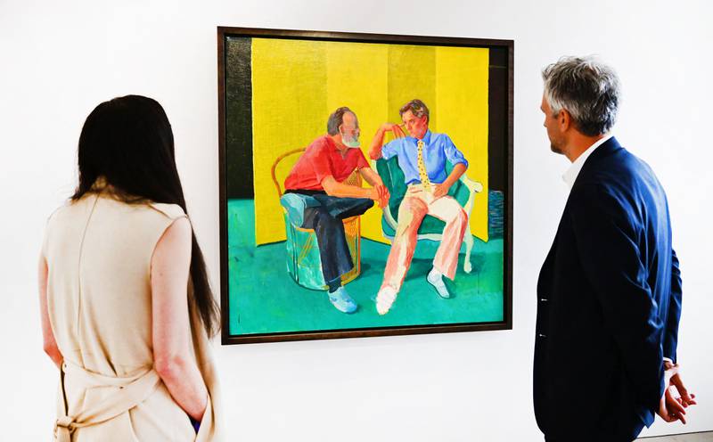 Christie's Alex Marshall, right, views 'The Conversation' by David Hockney on display at Christie's Los Angeles in Beverly Hills, California during the media preview of 'Visionary: The Paul Allen Collection'. Paintings and sculptures from the collection of late Microsoft co-founder Paul Allen were auctioned for a historic $1.5 billion, with records set for works by Van Gogh, Cezanne, Gauguin, Seurat and Klimt. AFP
