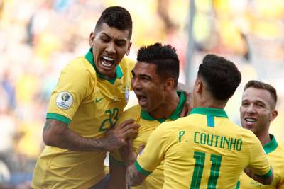 Brazil's Casemiro, centre, celebrates with teammates after scoring against Peru during their Copa America Group A match at the Corinthians Arena in Sao Paulo. AFP