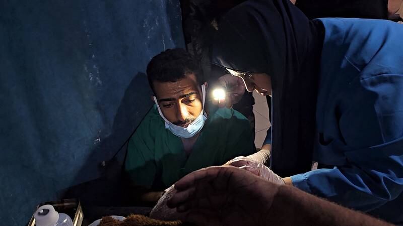 Medical staff work using flashlights due to a power cut at the Indonesian Hospital in the northern Gaza Strip. Reuters