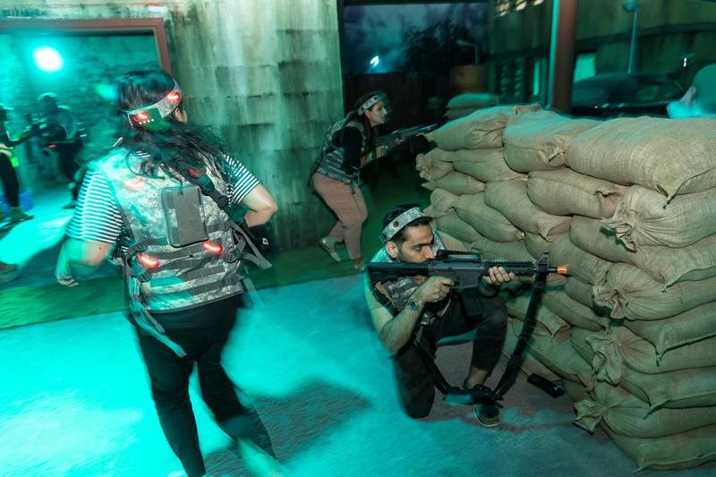 DUBAI, UNITED ARAB EMIRATES. 14 DECEMBER 2019. A first look at XStrike, a new entertainment concept launching in Dubai, which features live combat simulationand and promotes teamwork while providing entertainment through innovative new technology. Participants take part in a urban assault course style gun battle using laser based toy guns. Having been battle tested participants enjoy the second round of ‘combat’ in this exciting assault game. (Photo: Antonie Robertson/The National) Journalist: Hafsa Lodi. Section: National.