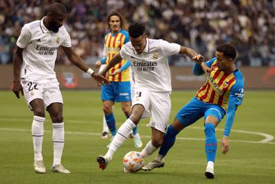 Madrid defender Eder Militao battles with Valencia forward Justin Kluivert. AFP