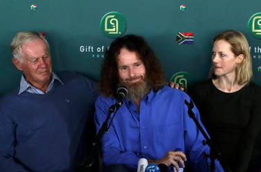 Stephen McGowan with his father Malcolm McGown, left, and wife Catherine, during a media conference in Johannesburg, South Africa. Credit: Themba Hadebe/ AP Photo