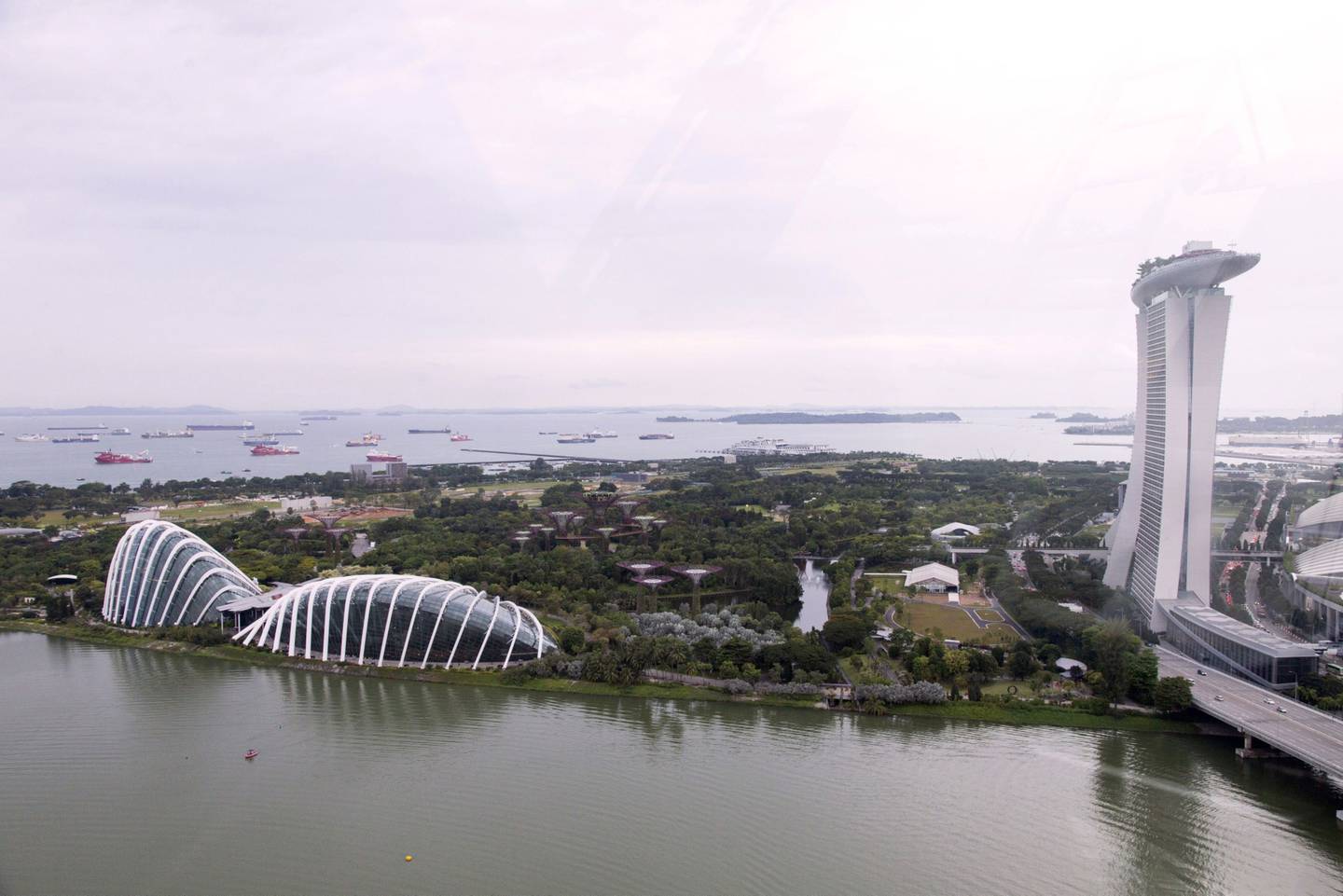 The Gardens By The Bay and Marina Bay Sands in Singapore. Bloomberg