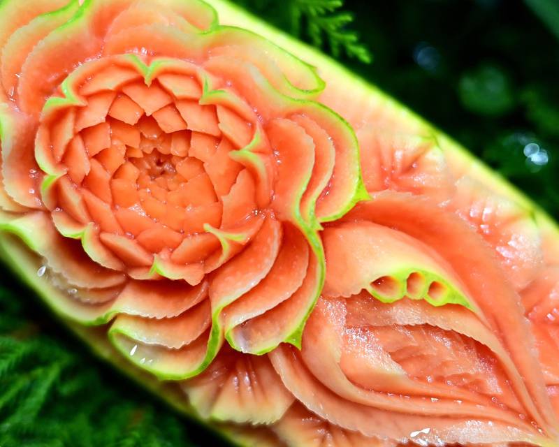Competitors created designs on fruit such as papayas.