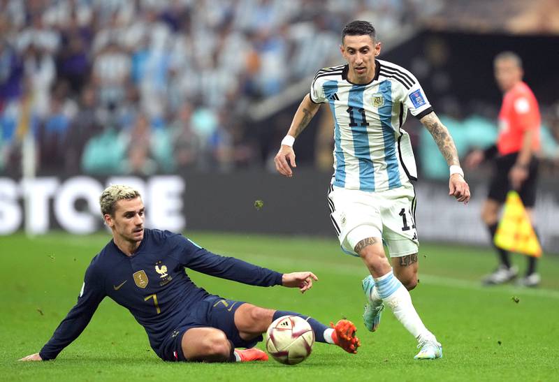 Argentina attacker Angel Di Maria skips past the challenge of France's Antoine Griezmann. PA