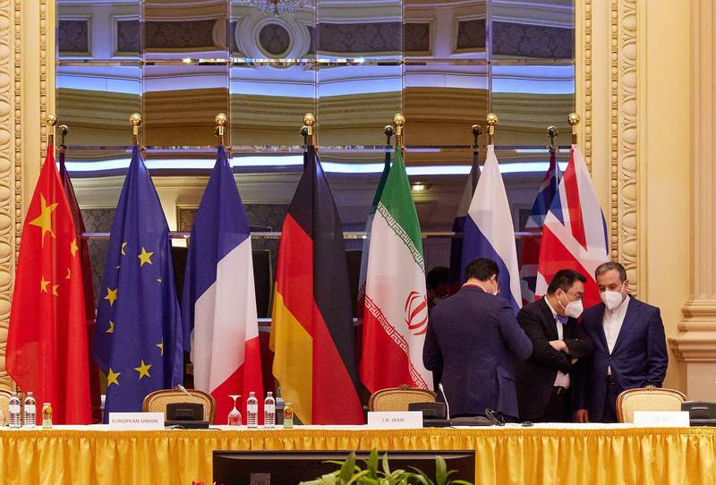 VIENNA, AUSTRIA - APRIL 27: In this handout image provide by EU Delegation Vienna, Iranian Deputy Foreign Minister Abbas Araghchi (R) speaks with other participants at the JCPOA Iran nuclear talks on April 27, 2021 in Vienna, Austria. Representatives from the United States, Iran, the European Union and other participants from the original Joint Comprehensive Plan of Action (JCPOA) are meeting both directly and indirectly over possibly reviving the plan. The JCPOA was the European-led initiative by which Iran agreed not to pursue a nuclear weapon in exchange for concessions, though the United States, under the administration of former U.S. President Donald Trump, abandoned the deal and intensified sanctions against Iran. (Photo by EU DELEGATION VIENNA via Getty Images)
