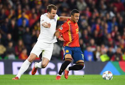 SEVILLE, SPAIN - OCTOBER 15:  Rodrigo of Spain holds off Harry Kane of England during the UEFA Nations League A Group Four match between Spain and England at Estadio Benito Villamarin on October 15, 2018 in Seville, Spain.  (Photo by David Ramos/Getty Images)