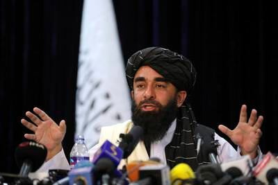 Taliban spokesman Zabihullah Mujahid speaks at his first news conference in Kabul.