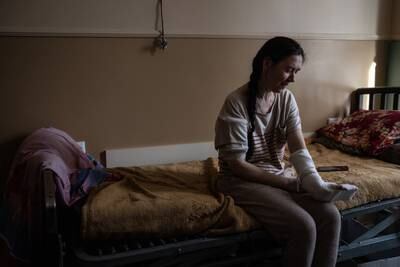 Yulia Dyrda, who sustained arm injuries from Russian shelling, recovers at a hospital in Chuhuiv, Ukraine. Getty Images