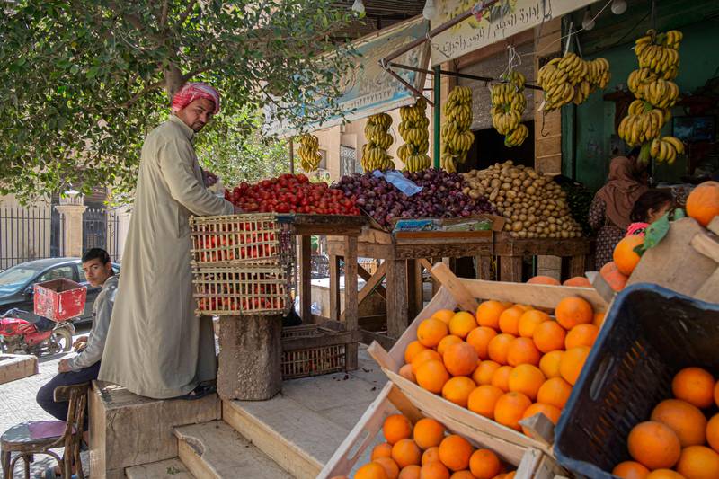 An Egyptian man arranges fruit at a shop in Cairo. UAE trade with OIC countries, such as Egypt, jumped 26 per cent year-on-year to Dh650 billion in 2021. AFP