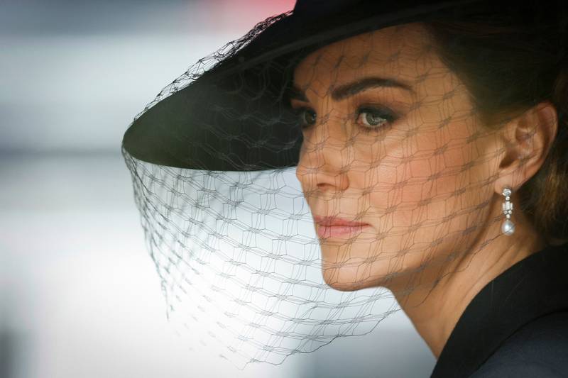 Catherine, Princess of Wales wears earrings featuring  features one brilliant-cut round diamond, four small round diamonds and three baguette-cut diamonds, with a Bahraini pearl dangling below. AFP 