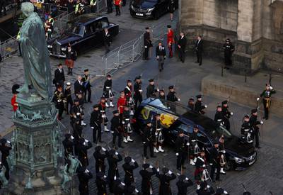 The hearse carrying the coffin of Queen Elizabeth II arrives at St Giles' Cathedral, Edinburgh, for a service of prayer and reflection.