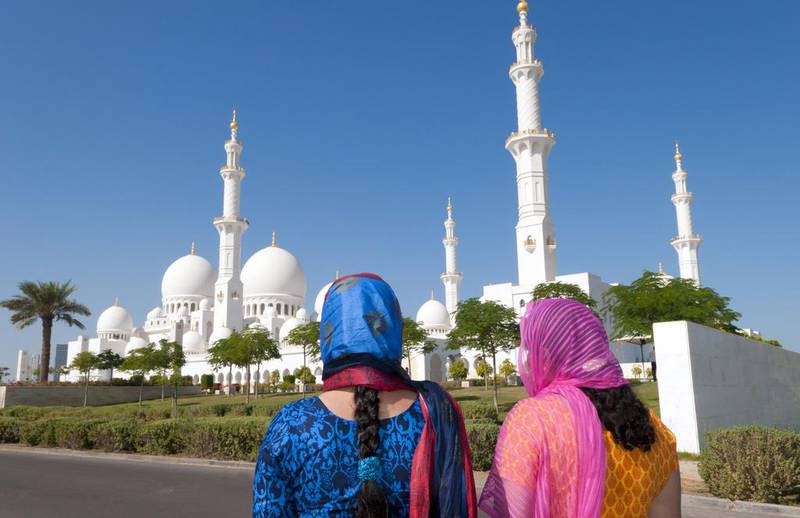 Above, Indian tourists at the Sheikh Zayed Grand Mosque in Abu Dhabi. Education Images / UIG via Getty Images