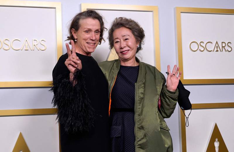 Best Actress and Best Supporting Actress: Frances McDormand for 'Nomadland' and Youn Yuh-jung for 'Minari' respectively, pose in the press room at the Oscars on Sunday, April 25, 2021, at Union Station in Los Angeles. AFP
