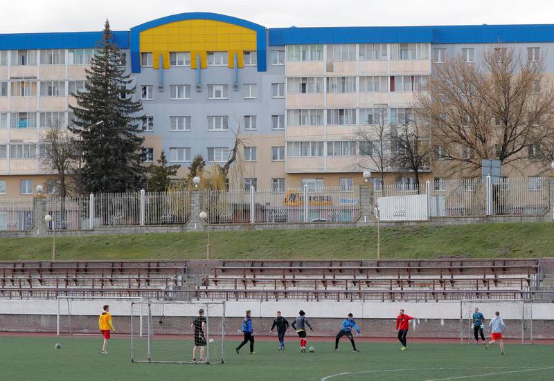 People play football outside the Stadyen Neman in Grodno. Reuters