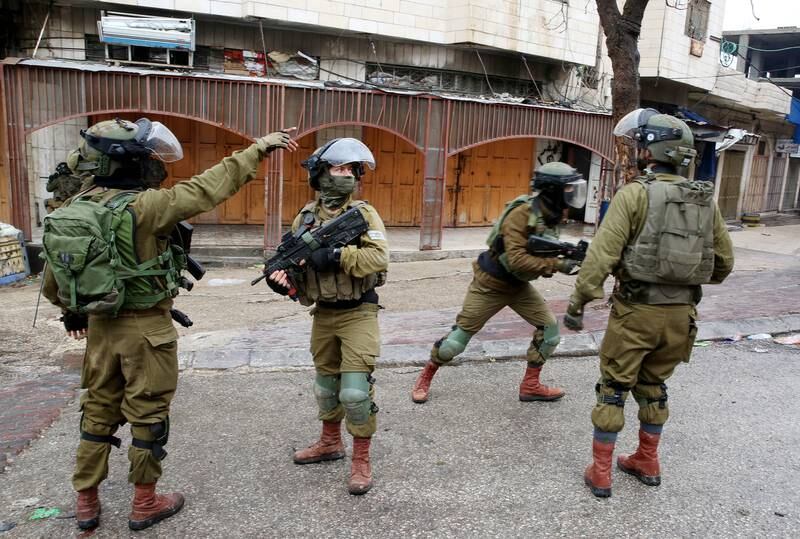 Israeli soldiers on patrol following a protest against Israeli settlements in Hebron. EPA