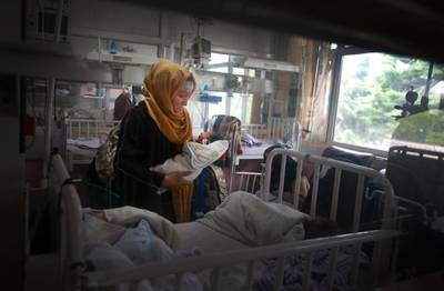 A rescued mother and her newborn baby receive medical care in a hospital after the complex attack at MSF hospital, in Kabul, Afghanistan.  EPA