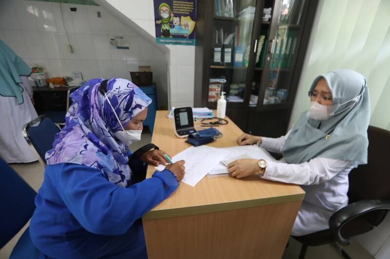 A pilgrim Banda Aceh, Indonesia, registers for a vaccination required to undertake the Hajj. EPA