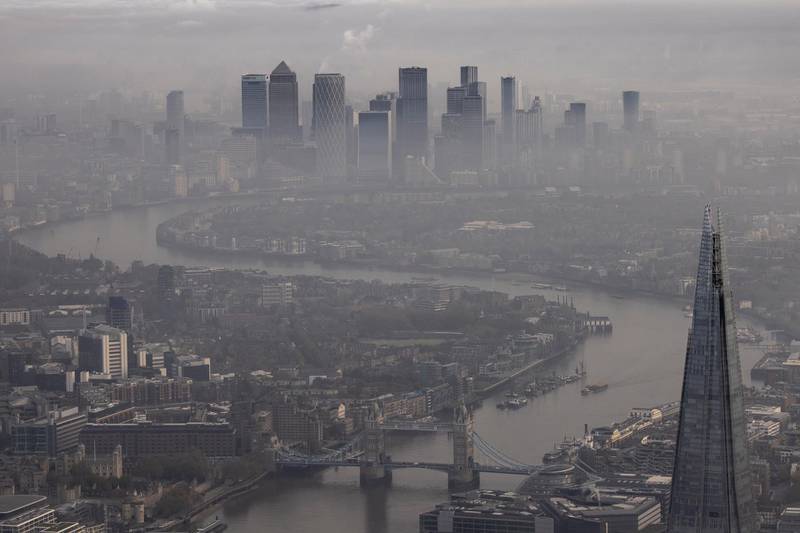 Fog shrouds the Shard and the view towards the Canary Wharf business district. Unlike the first lockdown earlier this year, schools in England will remain open. Getty Images