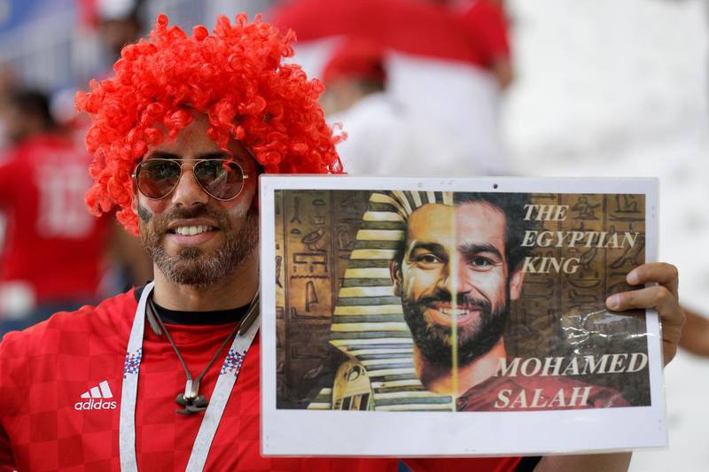 An Egypt fan holds a poster supporting Egypt's Mohamed Salah prior to the group A match between Saudi Arabia and Egypt. Andrew Medichini / AP Photo