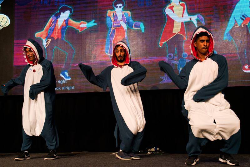 Emiratis Hamad Al Shamsi, left, Rashid Al Qubaisi, centre, and Abdullah Al Shamsi, right, perform as the "Squad of Sharks" in a dance-off. AP Photo