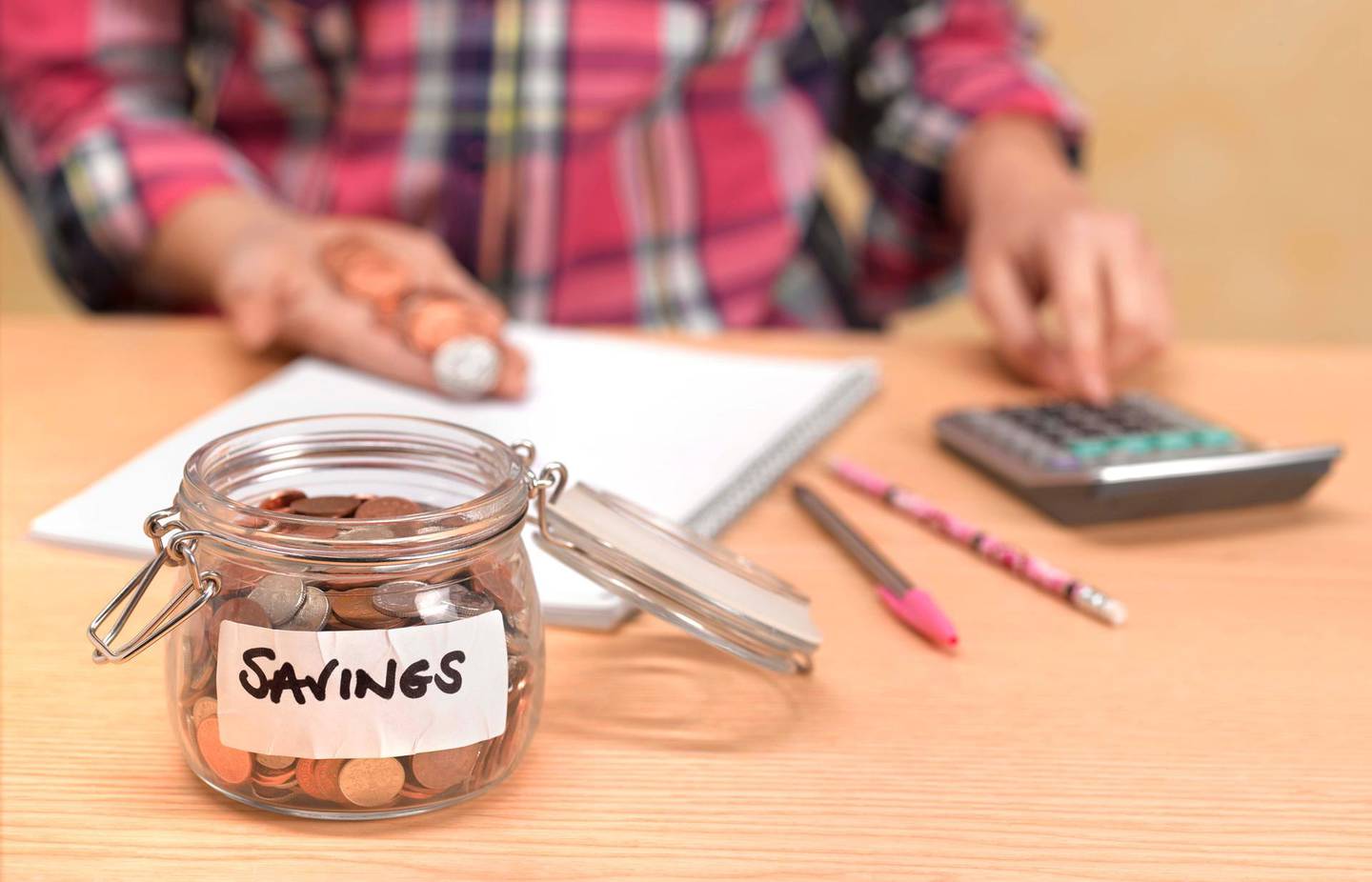 Teenager counting savings. Getty Images