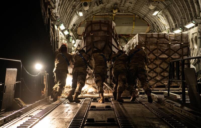 Airmen loading a pallet of formula on to an aircraft at Ramstein Air Base, Germany. US Air Force / EPA