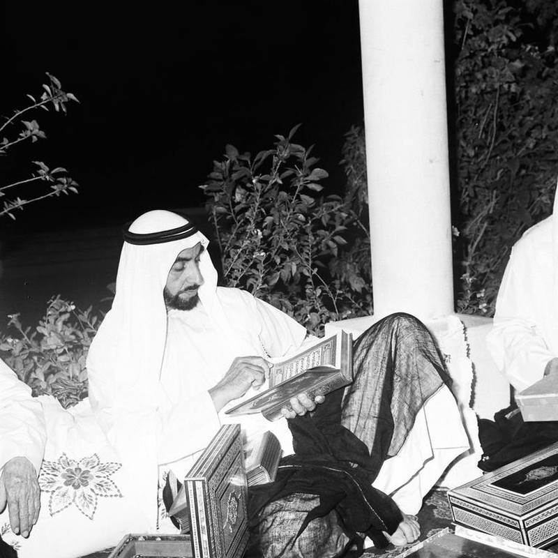 Sheikh Zayed reads the Quran during Ramadan in 1974. Courtesy Al Ittihad