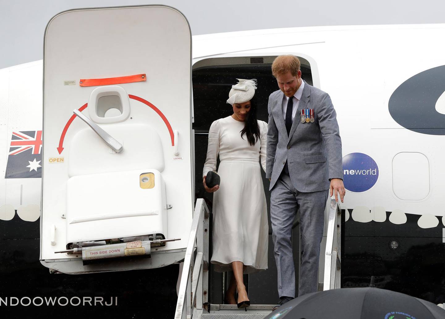 SUVA, FIJI - OCTOBER 23:  Prince Harry, Duke of Sussex and Meghan, Duchess of Sussex disembark from their plane on their arrival in Suva on October 23, 2018 in Suva, Fiji. The Duke and Duchess of Sussex are on their official 16-day Autumn tour visiting cities in Australia, Fiji, Tonga and New Zealand. (Photo by Kirsty Wigglesworth - Pool/Getty Images)