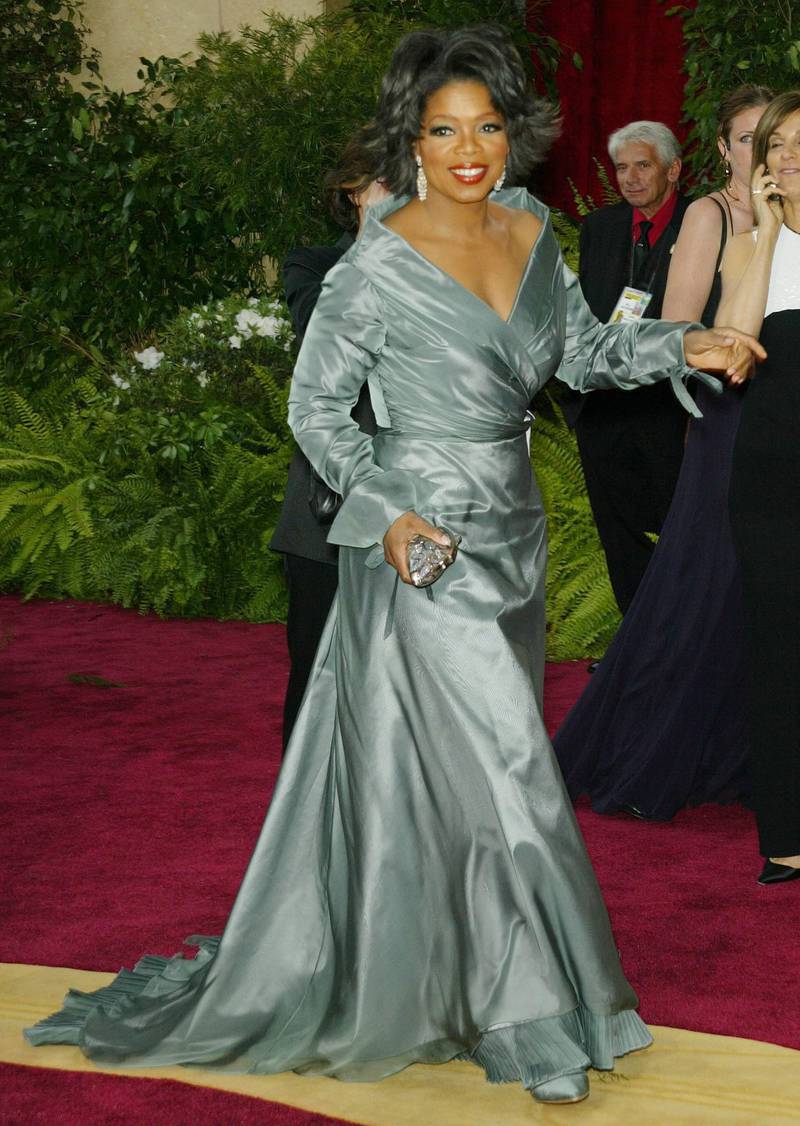 epa00144783 Oprah Winfrey poses for the media on the arrival area for the 76th Annual Academy Awards in Hollywood California 29 February 2004.  EPA/FRANCIS SPECKER