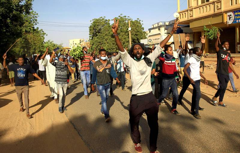 FILE PHOTO: Sudanese demonstrators chant slogans as they march along the street during anti-government protests in Khartoum, Sudan December 25, 2018. REUTERS/Mohamed Nureldin Abdallah -/File Photo