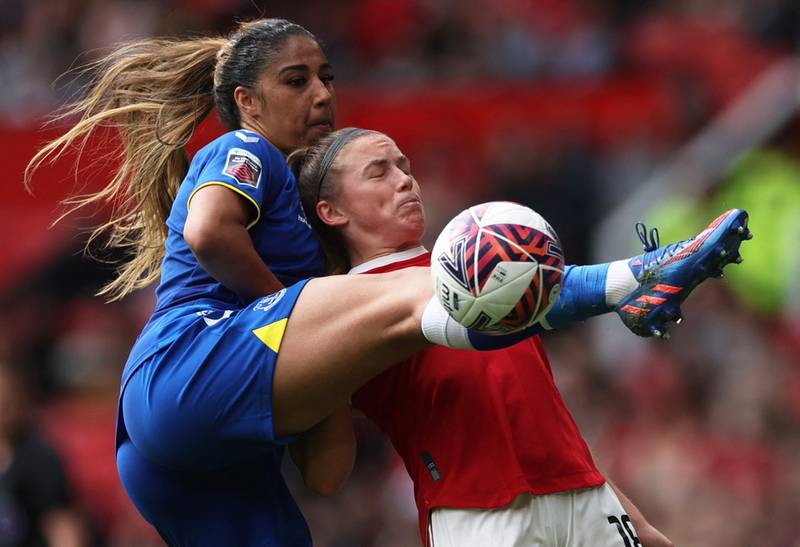 Manchester United's Kirsty Hanson battles for possession with Gabrielle George of Everton. Reuters