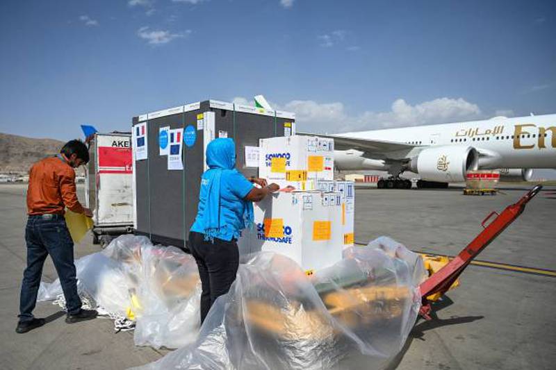 Unicef workers handle a supply of coronavirus vaccines at Kabul airport before commercial flights were stopped. Photo: AFP