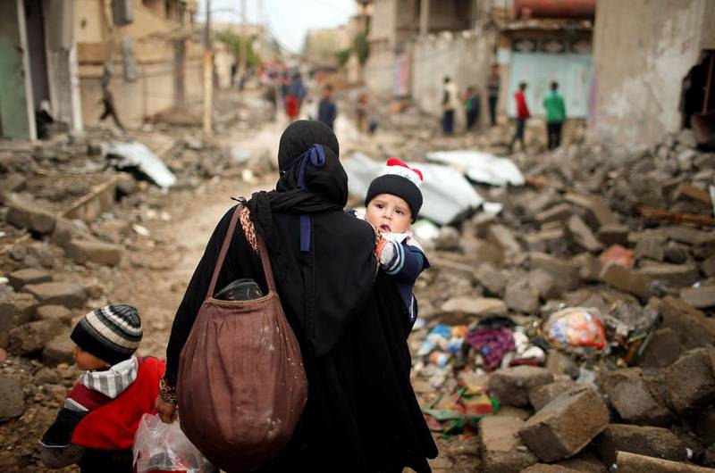 Displaced Iraqis flee their homes in western Mosul. A key aspect of this long-running war is the notion of keeping the states in which jihadis operate weak and unable to govern, or at least not govern the whole of a country. Suhaib Salem / Reuters