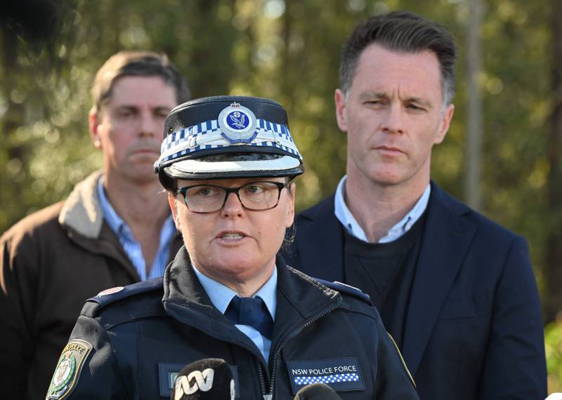 New South Wales premier Christopher John Minns, right, listens to Police Acting Assistant Commissioner Tracy Chapman give a press conference. AFP